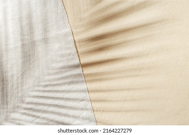 Summer background, top view beach towel on sand with  sun shadow from palm leaf. Summer aesthetic photo pale beige colored, copy space, nobody, vacation and relaxation concept. Top view sandy beach. - Shutterstock ID 2164227279