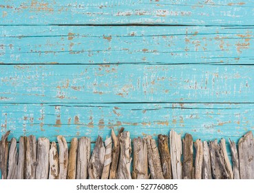 Summer background, turquoise blue wood with driftwood decoration and copy space. Holiday season.