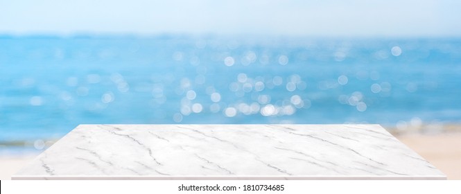 Summer Background.Empty Perspective Marble Table With Blur Sea And Sky Bokeh Background, Banner Mockup Template For Display Of Product