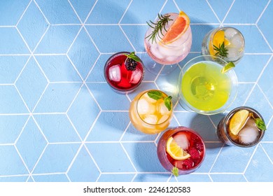 Summer bar cocktails menu. Set of different glasses variations of drinks, mocktails, cocktails, sparkling refreshing beach water. Citrus and fruit drinks with garnish and ice cubes copy space - Powered by Shutterstock