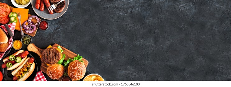 Summer BBQ Food Corner Border With Hot Dog And Hamburger Buffet. Top Down View Over A Dark Slate Banner Background. Copy Space.
