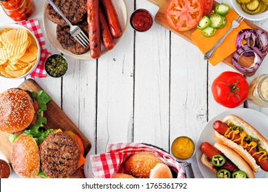 Summer BBQ Food Frame With Hot Dog And Hamburger Buffet. Overhead View Against A White Wood Background. Copy Space.