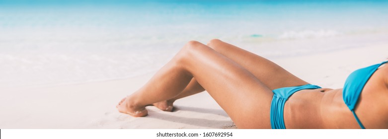 Summer Beach Bikini Body Woman Lying On White Sand Sun Tanning Smooth Legs Sun Tan For Laser Hair Removal Concept Banner Panoramic Background.