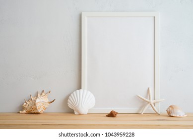 Summer Beach Holiday Vacation Concept, Photo Frame And Seashell Decoration Mockup With White Wall Background