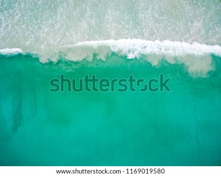 Similar – Aerial Drone View Of Blue Ocean Waves And Beautiful Sandy Beach Shore in Portugal