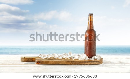 Summer beer on table and kitchen desk with ice. Free space for your decoration. 