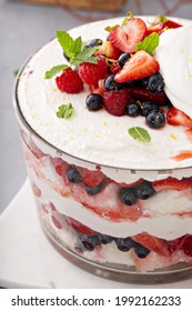 Summer Berry Red, White And Blue Trifle With Angel Food Cake In A Large Bowl. Dessert For 4th Of July, Independence Day Sweet Treat