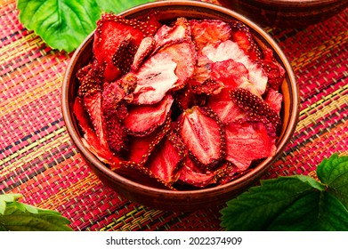 Summer berry,fruit dessert.Strawberry chips,berry sweetness in bowl.Dried strawberry slices