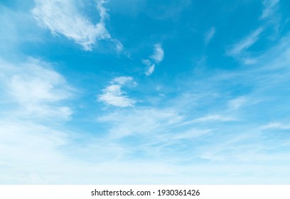 Summer Blue Sky And White Clouds Background. Beautiful Clear Cloudy In Calm Sunlight Spring Season. Cirrus Vivid Teal Cyan Cloudscape In Environment. Outdoors Horizon Skyline Fall Spring Sunshine Day.