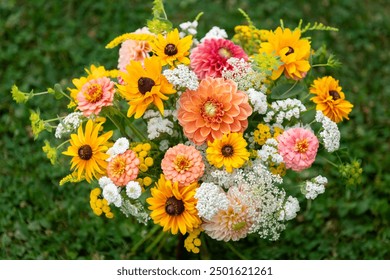 Summer bouquet. Beautiful orange and white fresh flower arrangement. Birthday or weddding bouquet made of summer flowers top view. - Powered by Shutterstock