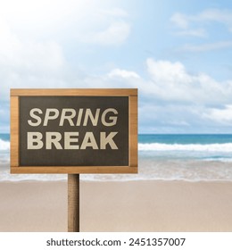 Summer break is shown using the text with wooden board against the beautiful beach in the background. Summertime concept idea.