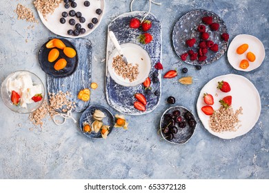 Summer Breakfast Food Concept With Dairy Product, Oatmeal Cereal, Berry And Fruits. Overhead Of Breakfast Blue Table With Yogurt, Kefir Oatmeals, Mix Berry And Fruits.