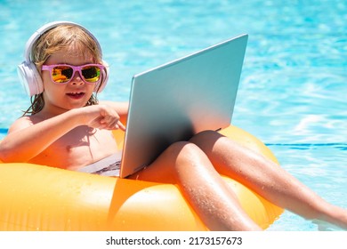 Summer Business. Child Working On Laptop In Summer Pool. Little Freelancer Using Computer, Remote Working In Poolside.