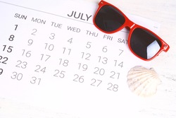 Summer Calendar Schedule With Summer Beach Accessories. Holiday Concept.