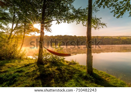 Similar – Image, Stock Photo Hammock on a lake with jetty