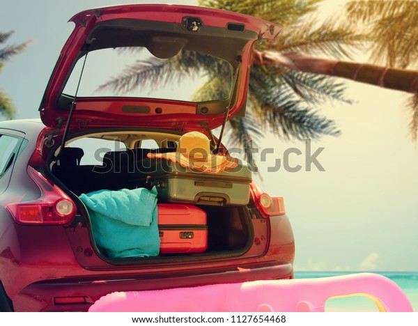 Summer car and free space for your decoration. Sea and\
palms background 