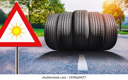 summer car tires on the street outside with traffic sign "summer