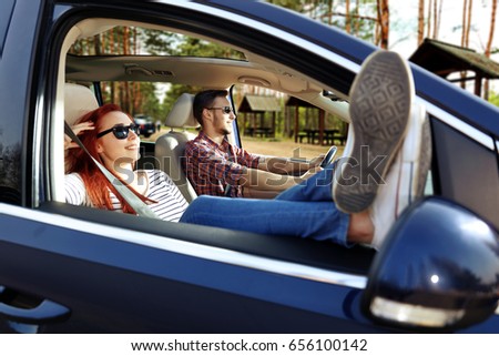 Similar – Two young women resting sitting inside of car