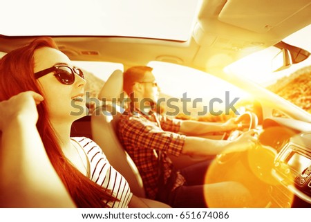 Similar – Two young women resting sitting inside of car