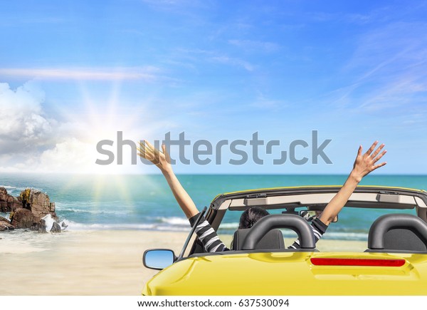 Summer car trip vacation .\
Yellow car at background of sea water. Travel, freedom and holidays\
concept.