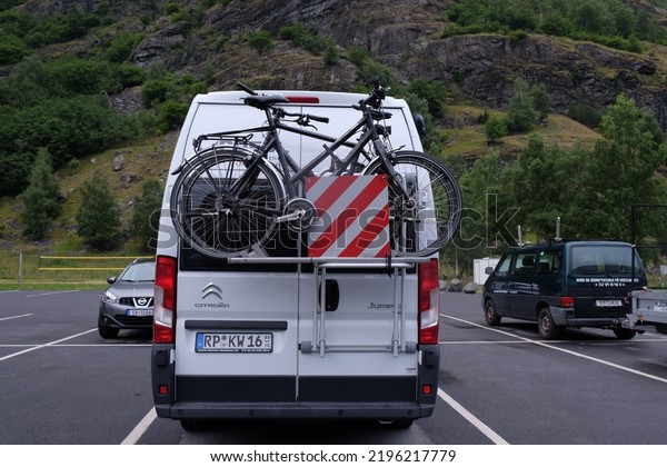 Summer Caravan\
Holiday concept, Caravan with bike on Norway roads, Caravan\
vacation, Norway, Europe, July\
2016.