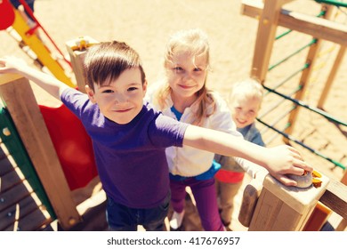 summer, childhood, leisure, friendship and people concept - group of happy kids on children playground - Shutterstock ID 417676957