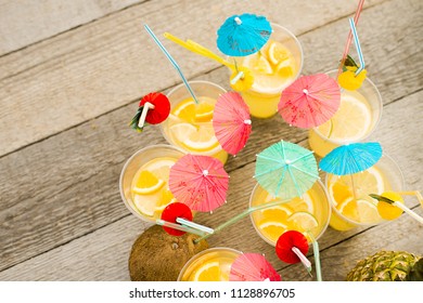 Summer Citrus Cocktail With Umbrellas. Refreshing Lemonade. View From Above. Bright Color.