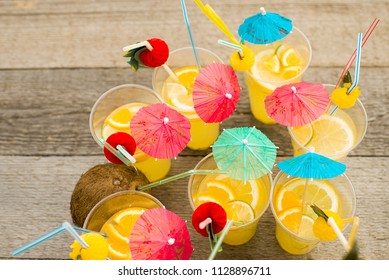 Summer Citrus Cocktail With Umbrellas. Refreshing Lemonade. View From Above. Bright Color.