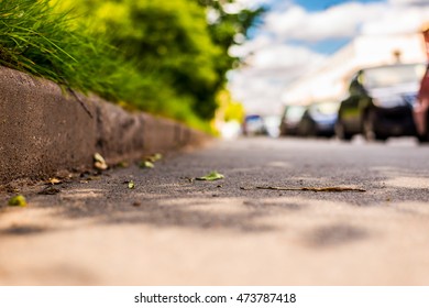 Summer In The City, The Cars On The Street. Close Up View Of A Level Curb On The Road