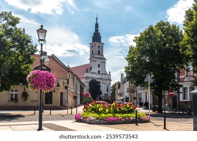 Summer cityscape of Wolsztyn, Greater Poland (Wielkopolska). Panoramic view of the sunny old town covered with flowers - Powered by Shutterstock