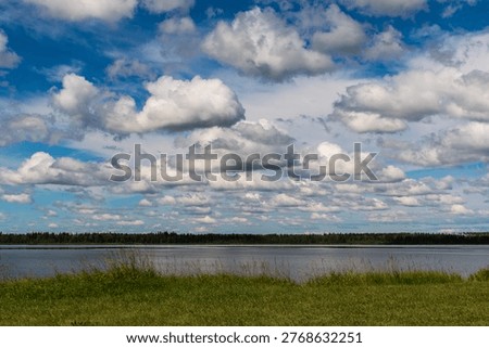 Summer clouds drift over Manitoba's Lake Audy in Riding Mountain National Park.