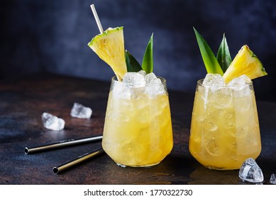 Summer cocktail and bar concept. Fresh alcoholic cocktail with pineapple and ice. Selective focus image with copy space