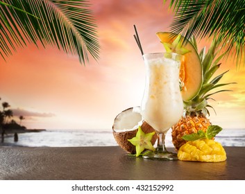 Summer cocktail with blur beach on background