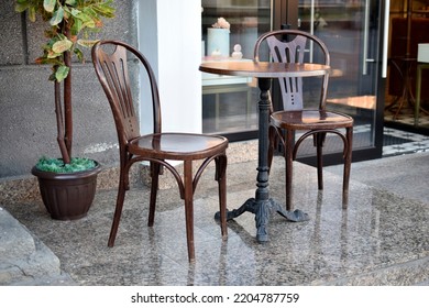 Summer Coffee Shop With Chairs And A Table. Beautiful Terrace With Beautiful Furniture. Background Texture. 