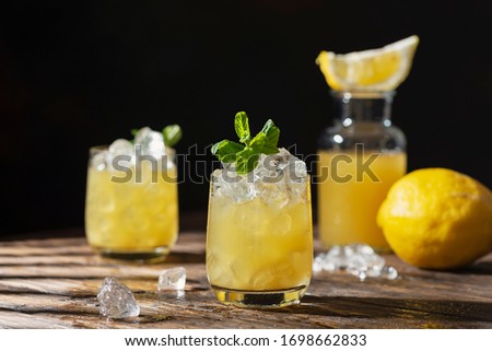 Summer cold cocktail with strong sun lights, selective focus image