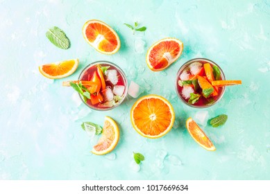 Summer Cold Drink, Blood Orange Mint Cocktail - Mimosa, Mojito Or Sangria,  Light Blue Background, Copy Space Top View