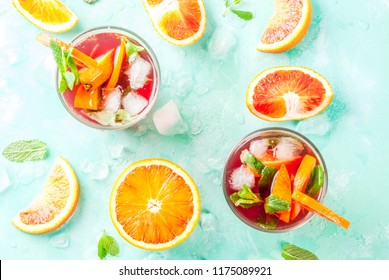 Summer Cold Drink, Blood Orange Mint Cocktail - Mimosa, Mojito Or Sangria,  Light Blue Background, Copy Space Top View