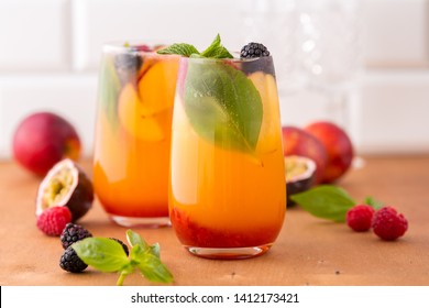 Summer Cold Peach Cocktail Or Mocktail With Basil, Raspberry And Blackberry