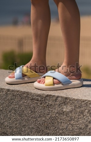 Summer comfortable collection of patriotic women's shoes. Ukrainian flag. White sandals