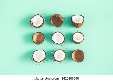 Summer composition. Coconut pattern on mint background. Summer concept. Flat lay, top view Arkivfotografi
