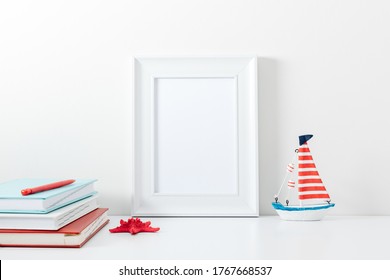 Summer Composition. Travel Concept. White Frame Mockup In Interior With Sea Elements On White Wall Background. Template Frame For Text. Poster Mockup.
