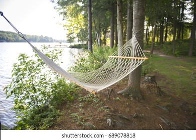 Summer Cottage Life With Hanging Hammock Facing Lake