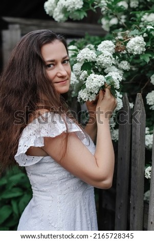 summer in the country. a girl and flowers.