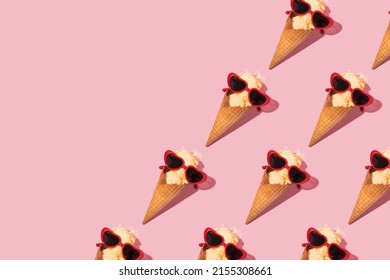 Summer creative pattern with melting ice cream cone and heart shaped sunglasses on pastel pink background. 80s or 90s retro fashion aesthetic ice cream concept. Romantic food Valentines day idea.