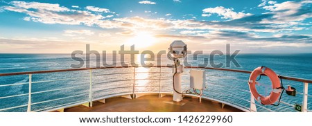 Summer cruise vacation concept. Panoramic view of the sea with a beautiful sunset just above the horizon.