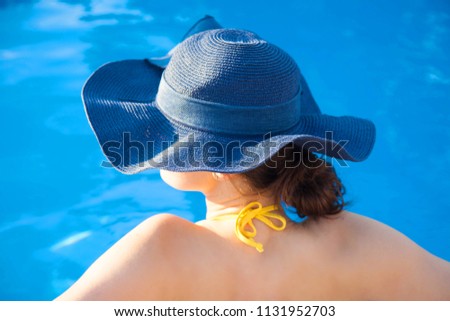 Summer day lifestyle woman relax near luxury swimming pool. Concept Summer