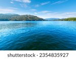 Summer day view of lakefront homes and docks at lower Twin Lakes, an 850 acre lake in the small suburban town of Twin Lakes, Idaho, a suburb of the general Coeur d