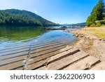 Summer day view of lakefront homes and docks at lower Twin Lakes, an 850 acre lake in the small suburban town of Twin Lake, Idaho, a suburb of the general Coeur d