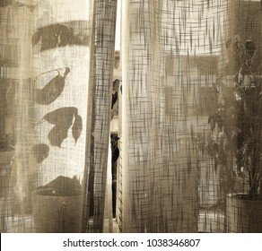 Summer Decorated Window With Plants Behind A Sheer Linen Ajar Curtain, Textured In Sepia Tones For A Rustic Vintage Feeling.