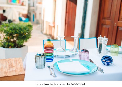 Summer Empty Outdoor Cafe At Old Tourist European City In Italy